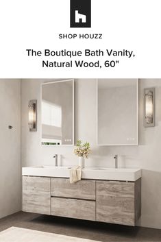 a bathroom vanity with two sinks and mirrors