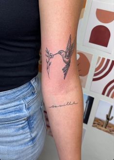 a woman with a hummingbird tattoo on her arm