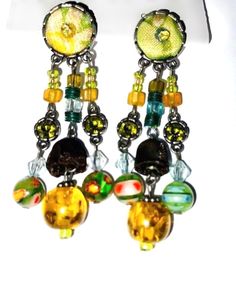 Unique Shop  Colourful vintage earrings Embroidery beads   Dangle earrings  Statement earrings * * Unique styles * * Personalized gift option available. Click on shop, to shop for related products. Shop Now. Click on link for more options: https://www.etsy.com/uk/shop/Africanswagshop?ref=seller-platform-mcnav . #BLACK FRIDAY SALE Vintage Metal Chandelier Earrings With Dangling Beads, Vintage Metal Earrings With Dangling Beads, Bohemian Drop Earrings With Bead Caps, Vintage Colorful Beaded Earrings For Gift, Silver Vintage Beaded Earrings With Dangling Beads, Vintage Metal Beaded Earrings With Dangling Beads, Colorful Vintage Beaded Earrings, Multicolor Bohemian Drop Clip-on Earrings, Retro Beaded Dangle Jewelry