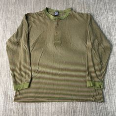 Vintage 90s Gap Basic Essential Striped Pattern Streetwear Skater Style 1990s Fashion Green Button Up Long Sleeve Shirt Large Mens Condition:  Fair Used Condition  = Holes And Staining throughout The Shirt Plus Distressing On The Sleeve Cuff Due To Age And Wear  Measurements: Please see photos above for all measurements IF YOU BUY TWO OR MORE ITEMS USE THE CODE BUNDLE @ CHECK TO SAVE 20% WE SHIP WITHIN 24 HOURS AFTER PURCHASE! Please be aware that we do not offer free returns!! The Buyer is resp Striped Crew Neck Top With Buttons, 90s Style Relaxed Fit Button-up Top, Retro Button-up Top For Winter, Retro Long Sleeve Shirt For Streetwear, Y2k Style Fall Tops With Buttons, 90s Striped Long Sleeve Tops, Y2k Cotton Tops With Button Closure, Striped Long Sleeve Streetwear Shirt, Striped Long Sleeve Shirt For Streetwear