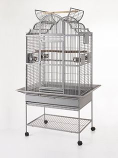 a large bird cage on wheels with two birds in it's top and bottom