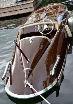 a small boat tied up to a dock