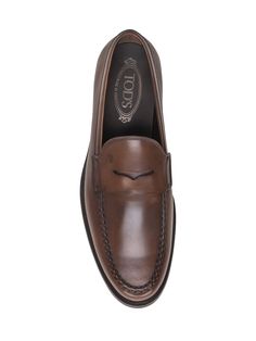 100% Cow Leather Sole:, 100% Rubber | Tod's Men's Logo Stamp Loafers in Brown | FW23/24 Formal Swift Leather Shoes With Leather Footbed, Formal Swift Leather Shoes, Formal Swift Leather Shoes With Stitched Sole, Formal Loafers In Swift Leather With Round Toe, Formal Swift Leather Loafers With Round Toe, Casual Brown Calf Leather Shoes, Leather Wingtip Moccasins With Leather Footbed, Leather Wingtip Moccasins With Leather Lining, Wingtip Leather Moccasins With Leather Lining