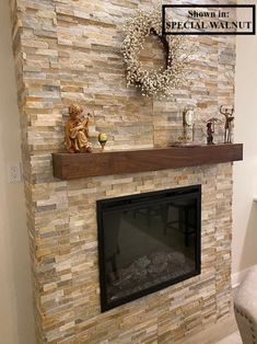 a stone fireplace with a wreath on the mantle