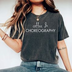 This "Coffee and Choreography" shirt is perfect for yourself or to gift to any friend, coworker or family member! It is made of high-quality soft garment-dyed fabric and is so comfortable to wear all year round! PRODUCTION TIME: 1-3 business days (Usually 2 days) SHIPPING TIME: 1-5 business days (Usually 3 days)  We do not guarantee delivery times PRODUCT DETAILS: Our Relaxed Fit Tee (Bella + Canvas style 3001) is a unisex style. 100% soft cotton (fibre content may vary for different colors). Li Coffee Cotton T-shirt With Screen Print, Coffee Color Cotton T-shirt With Screen Print, Coffee Cotton T-shirt With Text Print, Coffee Cotton T-shirt With Letter Print, Coffee-colored Cotton T-shirt With Letter Print, Dance Tshirts Designs Shirt Ideas, Cricut Sweatshirt, Tiger Paws, Dance T Shirt