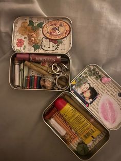 two tins filled with different types of items