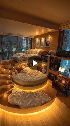 a room with some lights on the floor and a spiral bed in the middle, surrounded by bookshelves