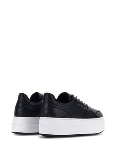 Step up your sneaker game with these stylish kicks. Crafted from luxurious leather, they're perfect for those who want to blend comfort with a touch of sophistication. Trust me, once you try them on, they'll become your go-to choice. Black and white calf leather with a panelled design Logo print to the side and debossed logo on the tongue Perforated toebox and round toe for a classic look Front lace-up fastening Branded insole for that extra touch of class Flatform sole for added height and styl Brown Leather Sneakers, Black Leather Sneakers, Hogan Sneakers, Latest Sneakers, Leather Accessories, Boys Shoes, Sneakers White, Design Logo, Mens Shoes Sneakers