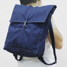 a man with a blue backpack on his back