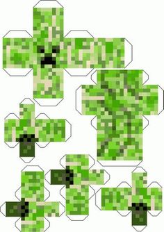 an image of some green pixelated paper pieces that are cut out and placed on top of each other