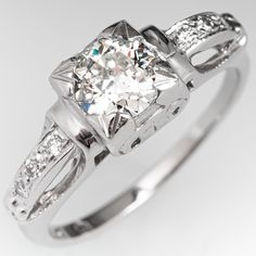 The vintage ring is centered with one (1) old European cut diamond weighing 0.57 carat. The shoulders of the ring are each accented with three (3), bead set, round brilliant cut diamonds. The ring measures 7.0mm at the top, rises 5.3mm above the finger, tapering to 1.4mm wide and 1.2mm thick at the base of the shank. This ring is currently a size 5.25 and we offer complimentary resizing to fit. Classic Diamond Ring With Diamond Cut, Classic Round Cut Single Diamond Ring, Heirloom Diamond Ring With Classic Cut, Vintage Platinum Diamond Ring With Single Diamond, Vintage Platinum Diamond Ring With Single Stone, Classic Diamond Ring With Single Cut Diamonds, Classic Asscher Cut Diamond Ring With Single Cut Diamonds, Heirloom Classic Cut Diamond Ring, Vintage Cubic Zirconia Diamond Ring Round Cut