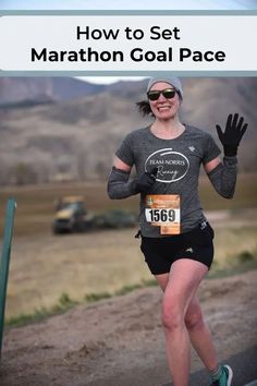 a woman running down a dirt road with the words how to set marathon goal pace