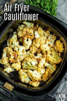 an air fryer with cauliflower in it