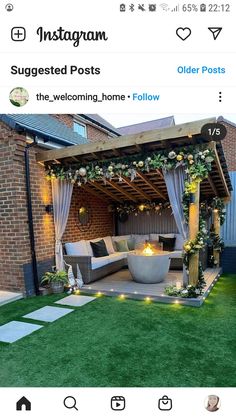 an outdoor living area with grass and lights