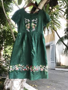 "\"Style is a way to say who you are without having to speak\"- Rachel Zoe. It's a green linen dress with hand embroidered flower. ❤ Item description: - A lovely dress with colourful embroidered flowers motifs. - Has lining, 2 hiden side pockets and a belt. - Very soft, skin friendly, breezy and comfortable. - Material: linen, hand embroidery, buttons. - Environmentally friendly. - This dress is very useful, go with any outfit, that can be used to go to school, go out, go shopping.    It is a perfect gift for yourself or your beloved.  ❤ Care instructions:      The best way to wash embroidery cloth is to put it in soapy water (with a mild detergent and cold water at 86 ºF/30oС) for 20 minutes. Try to not wash the item with other clothing that might cause damage, such as zippers, buttons or Embroidered Green Dress, Flowers Motifs, Embroidery Buttons, Hand Embroidered Flower, Hand Embroidered Dress, Green Linen Dress, Flower Embroidered Dress, Dark Green Dress, Go To School