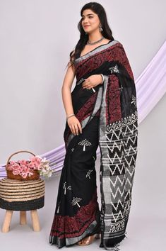 Discover timeless elegance with our Handblock Printed Linen by Cotton Saree, a masterpiece that blends tradition with modern sophistication. Crafted meticulously by skilled artisans, each saree tells a story of craftsmanship and heritage. Made from high-quality linen and cotton blend, this saree promises comfort along with a luxurious feel. The handblock printing technique used ensures that each motif is unique and exquisitely detailed, making it a wearable piece of art. Whether you wear it for Black Slub Silk Saree, Black Cotton Silk Saree With Cutdana, Black Block Print Saree With Traditional Drape, Unstitched Black Saree With Block Print, Black Slub Silk Saree With Cutdana, Black Slub Silk Saree Traditional Drape, Black Saree With Block Print And Traditional Drape, Unstitched Black Block Print Traditional Wear, Black Block Print Blouse Piece For Diwali