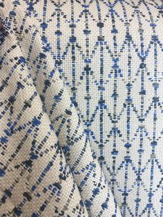 blue and white patterned fabric with small dots on the back, as well as other patterns