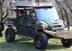 an off road vehicle parked in the grass