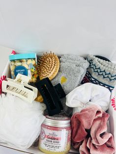 a box filled with lots of items like hair brush, scrubs and other things