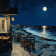 an image of a restaurant by the ocean at night