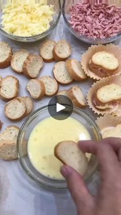 a person is dipping some food into small bowls