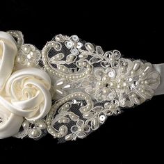 A Romantic Beaded Belt for your Wedding Dress Add instant romance to your wedding dress with this oh-so-feminine beaded bridal sash belt! Beautiful satin flowers and beaded alencon lace give this wedding dress belt unbeatable charm. The belt is decorated with pearls, sequins and crystals for just the right amount of sparkle! The perfect accessory for your bridal gown! Size: Floral Applique is 6 3/4" long and 3" wide on 3/4" ribbon that is 95" long. This item is intended to be tied in a bow at th Bridal Accessories Headpieces, Personalized Wedding Details, Beaded Bridal Sash, Wedding Jewelery, Headpiece Accessories, Perfect Wedding Shoes, Bridal Sash Belt, Wedding Dress Belt, Beaded Wedding