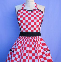 a red and white checkered apron on a mannequin