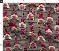 the fabric has pink and black gnomes on it, with flowers in their hats