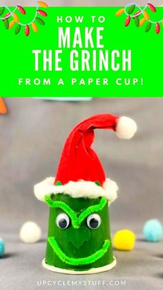 a green cup with a red santa hat on it and the words how to make the grin from a paper cup