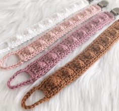 three crocheted hair ties laying on top of a white furnishing area