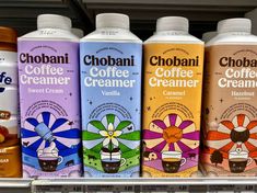 many different flavors of coffee creamer are on display