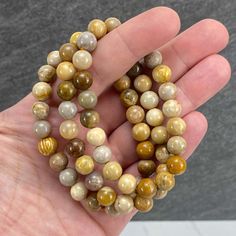 "Polished beads made from fossilized coral also known as coral jade. 8mm Bracelets Sized: 6.50\" - 7.00\" Our crystals and minerals are natural, and some are shaped by hand. Because each is unique and one of a kind, some may come with small chips or imperfections. Any appearances of cracks are one of the natural characteristics of this crystal or mineral and not because of damage. We select all crystals and minerals by hand. We choose the most unique and highest quality we can find. We try to ta Jasper Bracelets For Healing With Round Beads, Healing Jasper Beaded Bracelets With 8mm Beads, Jasper Gemstone Beads Bracelet, Jasper Gemstone Beaded Bracelets, Beaded Jasper Bracelets With Gemstone Beads, Jasper Beaded Bracelets With Natural Stones, Hand-strung Jasper Beaded Bracelets With Round Beads, Earthy Jasper Round Bead Bracelets, Earthy Jasper Beaded Bracelets