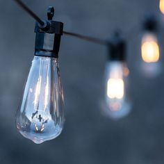 some light bulbs are hanging from a string