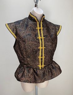 New adult women's Renaissance Medieval Elizabethan Revolutionary pirate colonial Buccaneer jerkin vest coat robe costume. Size medium. This stunning professional quality jerkin is a rich copper and black brocade fabric.  Stand up collar. Front opening with stunning regal gold clasps. Fully lined.  New not worn.  Back length from shoulder is 21 ".   All sales final. Will exchange for a different size. Great for your next theme party, stage production or special event. Medium is for a 38" bust and 30" waist Black Vest For Halloween Costume, Fitted Vest For Larp And Halloween, Traditional Fitted Black Vest, Medieval Vest, Medieval Fitted Vest For Costume, Medieval Style Fitted Costume Vest, Medieval Style Black Vest For Larp, Vintage Fitted Vest For Cosplay, Medieval Fitted Costume Vest