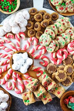 an assortment of cookies and candy on a platter