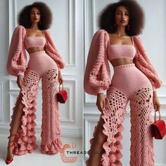 a woman wearing pink crochet clothing and high heels