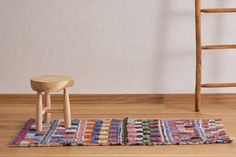 a wooden chair and stool in a room