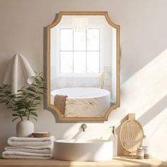 a bathroom with a sink, mirror and bathtub in the corner next to a potted plant