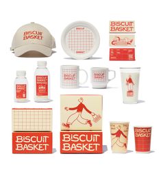 the biscuit basket is displayed with cups and saucers, including a baseball cap