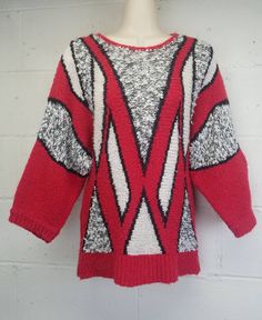 Vintage 1980s Knit sweater. Abstract geometric design. Pullover. Fastens at the back of the neck with a little faux pearl button. Good vintage condition. Shows a little age appropriate wear. There is piling throughout. Close ups shown in the photos. Fits most like a modern size small. Please use measurements provided to decide if the fit is right for you. Garment is measured flat. Shoulder to shoulder - 16 inches Bust (armpit to armpit) - 16 inches Waist - 15 inches Length - 26 inches Sleeve Len 80s Color Block, Baby Blue Maxi Dress, Wave Sweater, Geometric Sweater, 80s Sweater, Glam Tops, Beaded Sweater, Eve Outfit, New Years Eve Outfits