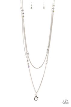 a necklace and earring set on a white background