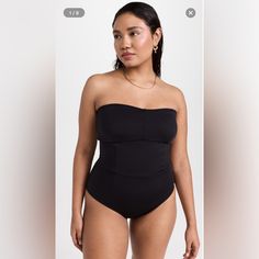 Nwt Good American Sculpt Strapless One Piece A Sleek And Strapless Good American Swimsuit In Jet-Black Fabric, Outfitted With Corset-Style Ties In Back. New With Tag Also Has Plastic Fastener Still Attached As Pictured Medium Coverage Size 0=Xs Princess Seams Strapless Top Lace-Up Back Lined Cups With Removable Padding Wireless Cups Shell: 62% Nylon/38% Elastane Lined Lining: 95% Polyester/5% Elastane Wash Warm Imported Outfit With Corset, American Swimsuit, Strapless One Piece, Orange Swimsuit, One Piece Swim, Princess Seams, Corset Style, Fitted Skirt, Good American