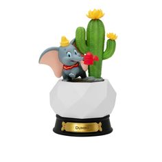 an elephant figurine sitting in a pot next to a cactus on a white background