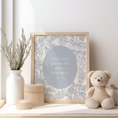 a teddy bear sitting on top of a shelf next to a vase