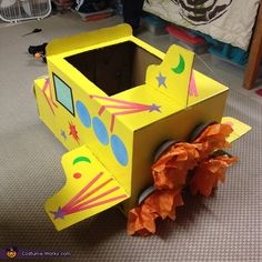 a cardboard box with an airplane on the side and some orange tissue paper around it