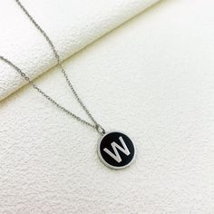 For the modern minimalist, our Alphabet Letter Round Black Initial Charm Necklace is a must-have accessory! This sleek and stylish necklace is available in both gold and silver, featuring a cute black and gold initial charm that adds a personalized touch to any outfit. Choose your favorite letter or stack multiple necklaces for a trendy accessory that's perfect for expressing yourself in style. Available in gold and silver. Multiple Necklaces, Initial Necklace Silver, Initial Necklace Gold, Stylish Necklace, Gold Initial, Initial Charm, Trendy Accessories, Initial Necklace, Cute Black