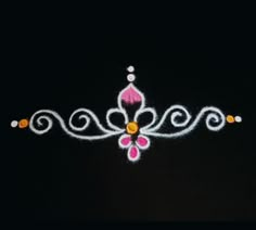 a white and pink tiara on a black background