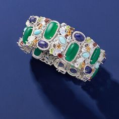 Ross-Simons - 90.00 ct. t. w. Multi-Gemstone Bracelet in Sterling Silver. 7". An RS exclusive. An explosion of colors, shapes and textures, this bracelet will take your breath away! Nestled amongst beaded frames of sterling silver are a bright mix of large green chalcedony, lapis, Larimar, moonstone, citrine, smoky quartz, white and blue topaz, peridot and garnet gems, 90.00 ct. tot. gem wt. Bold and beautiful, our design is the perfect complement to your neutral-colored outfits. 1 1/8" wide. Do Luxury Multicolor Gemstone Bracelets, Luxury Multicolor Multi-stone Bracelets, Luxury Multicolor Gemstones, Luxury Multicolor Stone Bracelets, Luxury Multicolor Bracelets With Stones, Luxury Multicolor Jeweled Bracelets, Formal Multi-stone Gemstone Bangle, Luxury Multicolor Natural Gemstones, Luxury Bangle Bracelet With Natural Stones