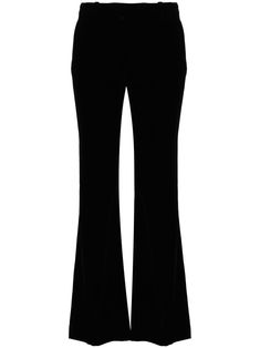 black velvet flared mid-rise concealed front button, hook and zip fastening belt loops two diagonal pockets to the sides two rear welt pockets straight hem Black Velvet Pants For Party, Black Velvet Bottoms For Night Out, Black Elegant Evening Flares, Elegant Black Flares For Evening, Elegant Black Evening Flares, Flared Velvet Bottoms, Elegant Black Velvet Bottoms, Elegant Black Flares For Night Out, Black Fitted Velvet Pants