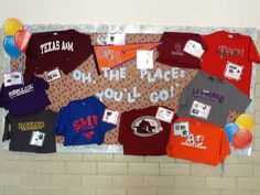 a bulletin board with t - shirts and balloons on it